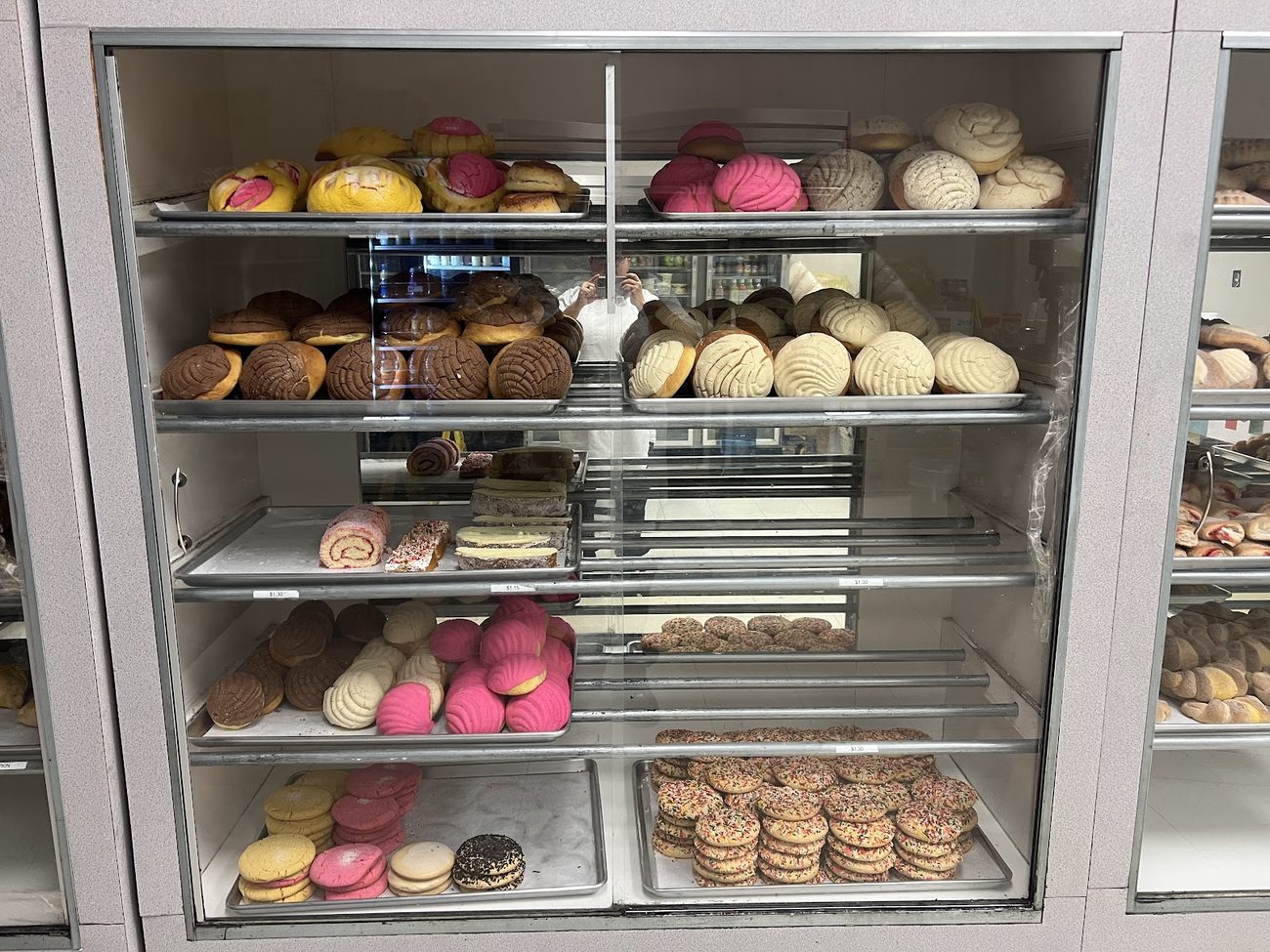 Case of fresh conchas and pan dulce at La Esperanza Bakery